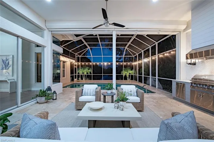 View of patio featuring area for grilling, an outdoor kitchen, and ceiling fan