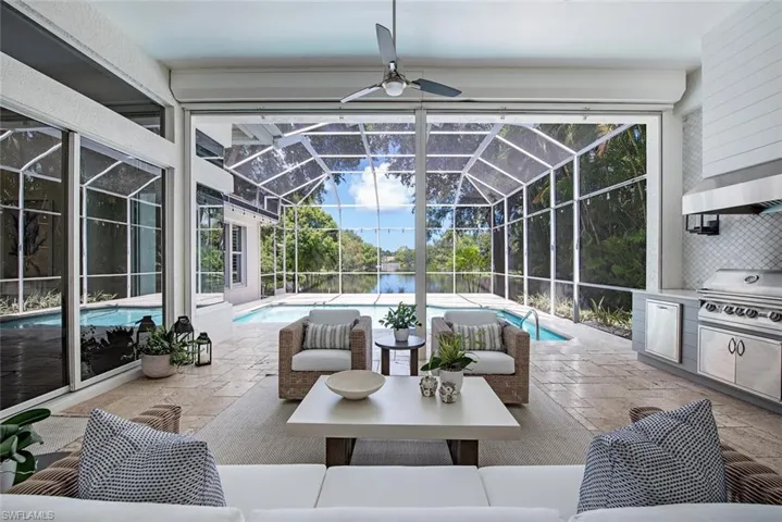 Sunroom / solarium featuring ceiling fan