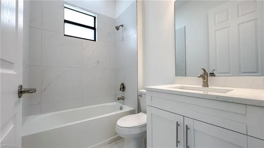 Full bath featuring vanity and shower / bathtub combination