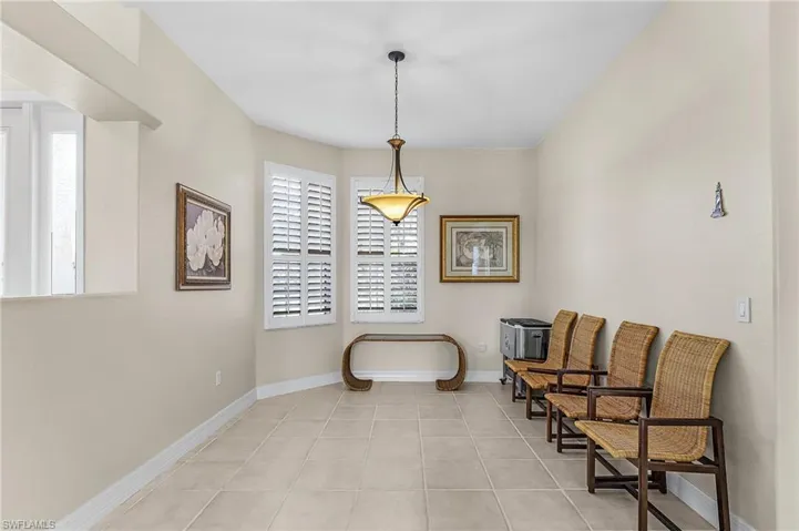 Sitting room with light tile patterned floors and baseboards