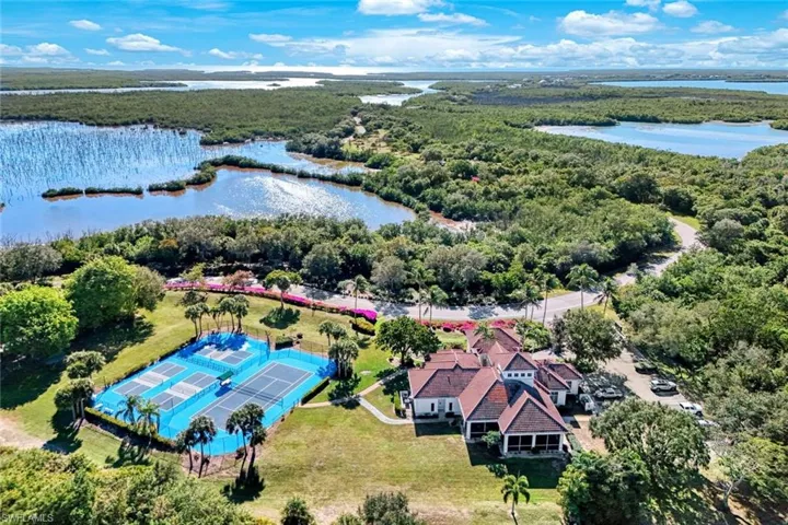 Bird's eye view of a heavily wooded area and a large body of water