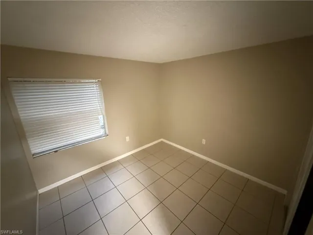 Spare room with tile patterned floors