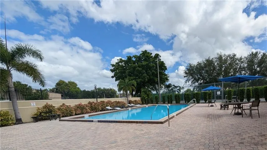 Community pool featuring a patio