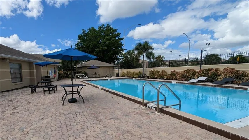 Community pool featuring a patio area