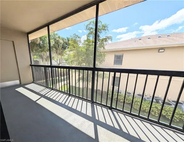 Balcony featuring a sunroom