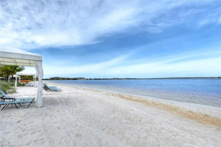 View of water feature with a view of the beach and a gazebo