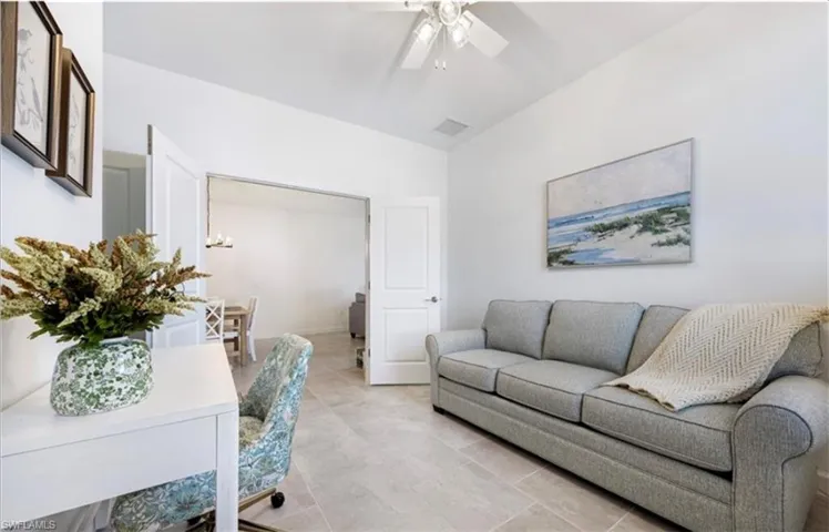 Living room featuring ceiling fan