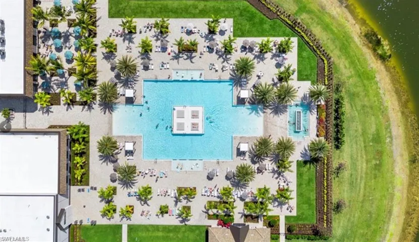Bird's eye view of a pool and a large body of water
