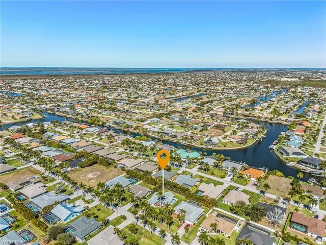 View of property location featuring nearby suburban area and a large body of water