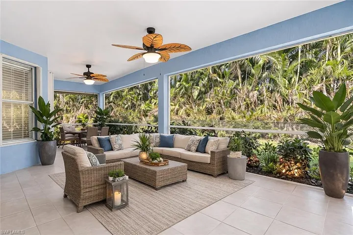 virtual staged View of patio / terrace featuring a ceiling fan and outdoor seating