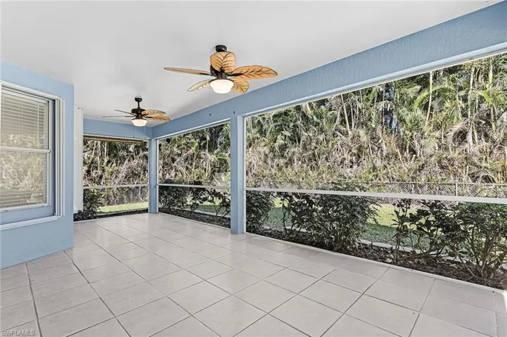 Unfurnished sunroom with a ceiling fan