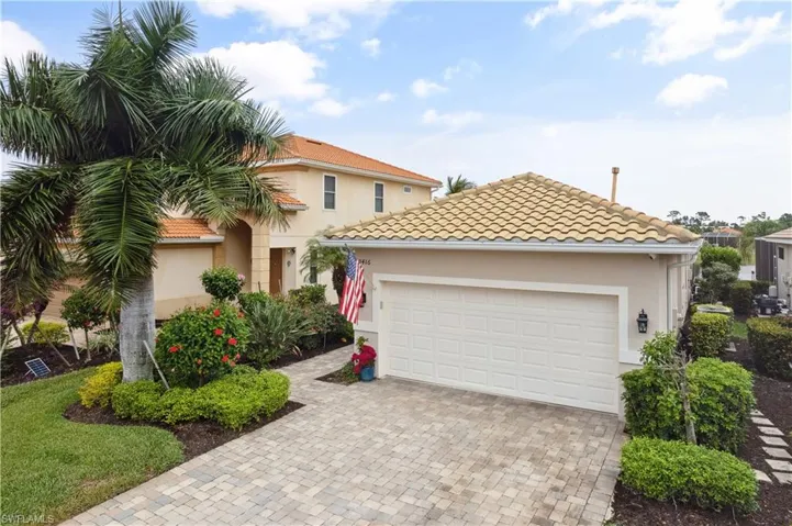 Mediterranean / spanish-style home featuring a garage