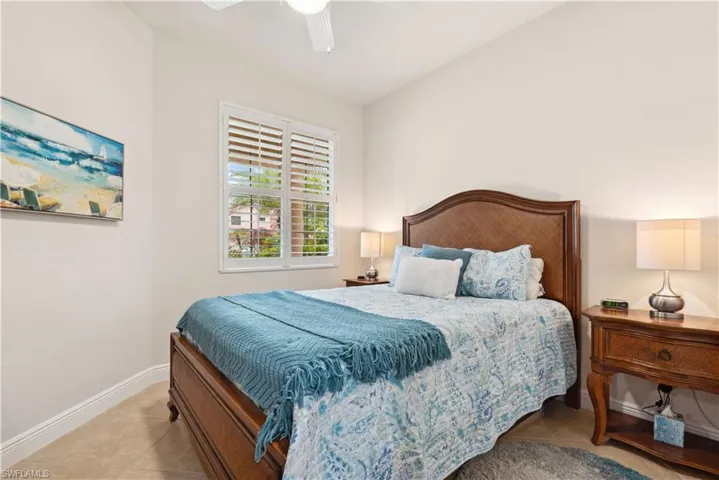 Tiled bedroom with ceiling fan