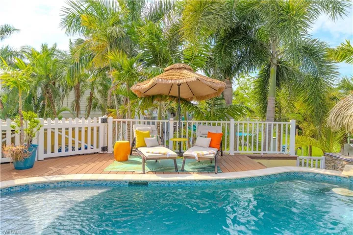 View of pool with a wooden deck - Virtually Edited Image