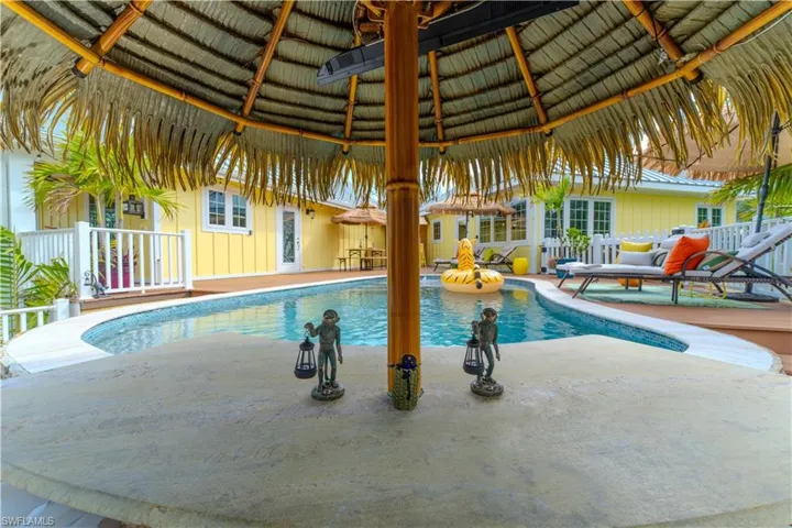 Outdoor pool featuring a gazebo and a patio area - Virtually Edited Image
