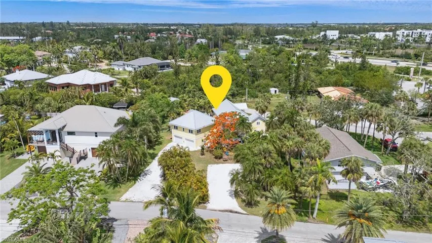 Aerial perspective of suburban area featuring a tree filled landscape- Virtually Edited Image