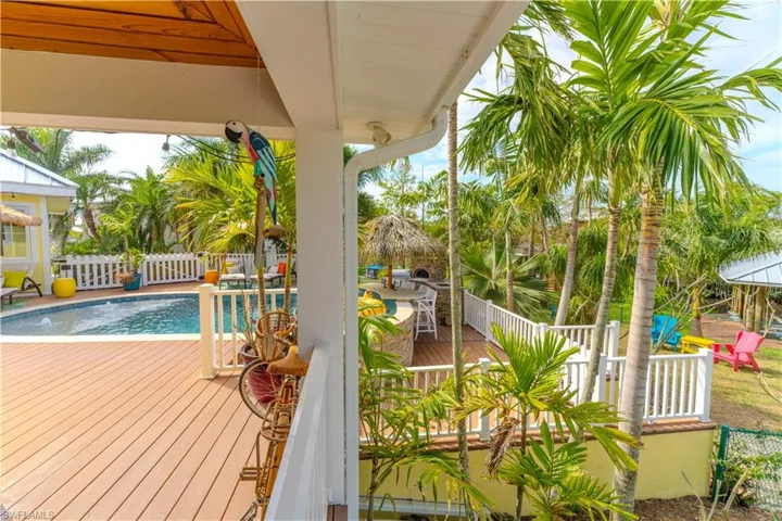 Wooden deck featuring a fenced backyard- Virtually Edited Image