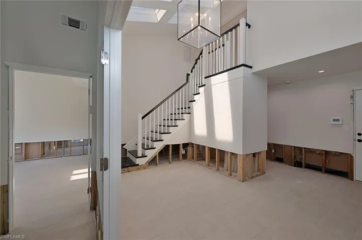 View of elegant stairs from entryway.