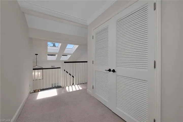 View of stairwell from upstairs hallway.