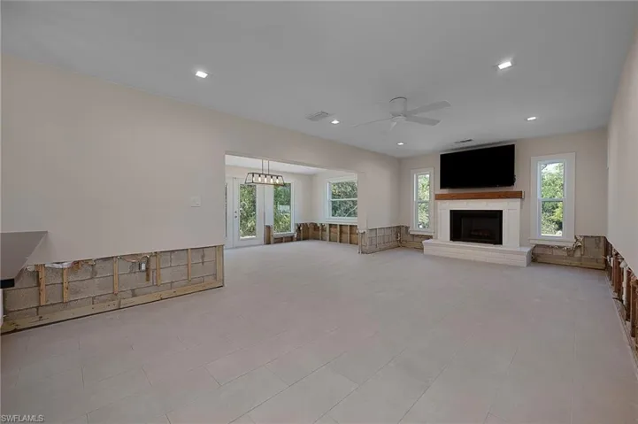 Living room features a wood burning fireplace.