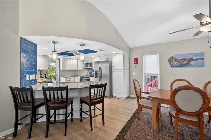 Kitchen with bar seating and dining area!