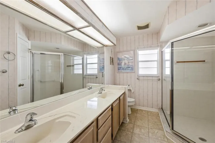 Dual sinks with a large walk-in shower