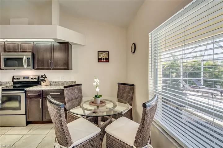 Dining area featuring light tile patterned flooring
