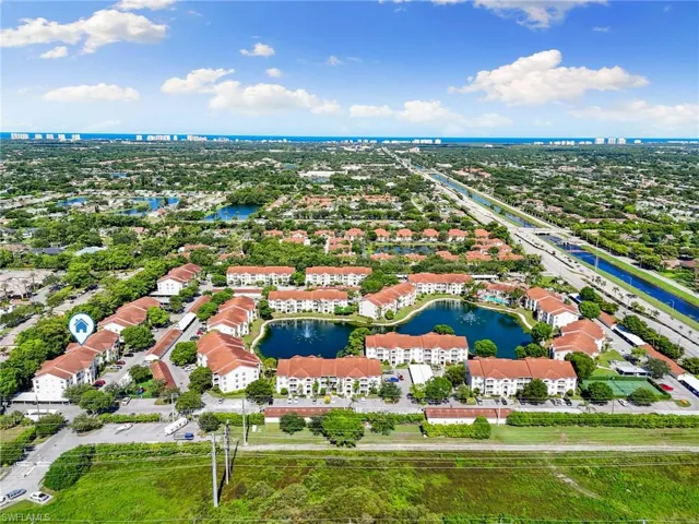 Aerial perspective of suburban area with a large body of water