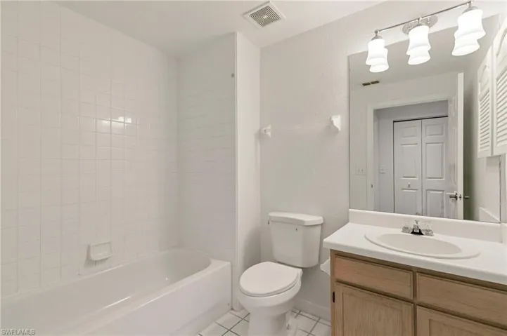 Second bedroom bathroom featuring vanity, tile patterned floors, and shower / bathtub combination