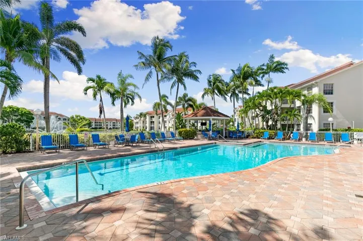 Community pool featuring a gazebo, a patio, and a residential view