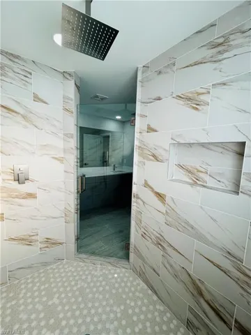 Bathroom featuring walk in shower
