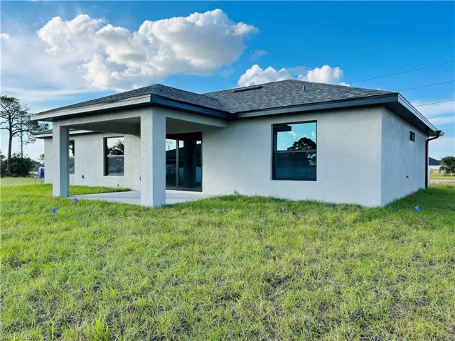 Back of house featuring a patio and a yard