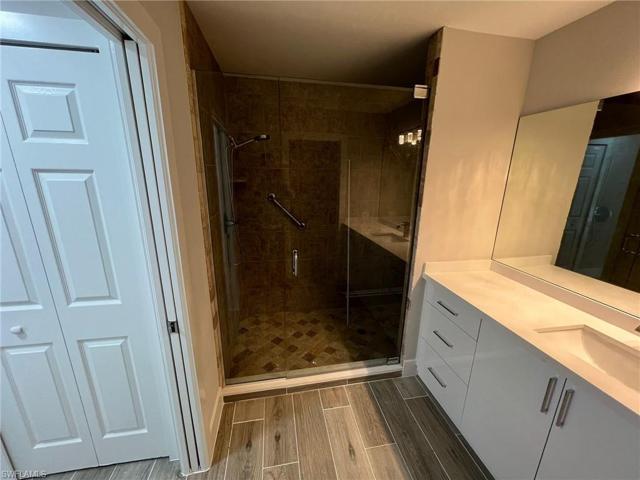 Glass door and mirrors installed
