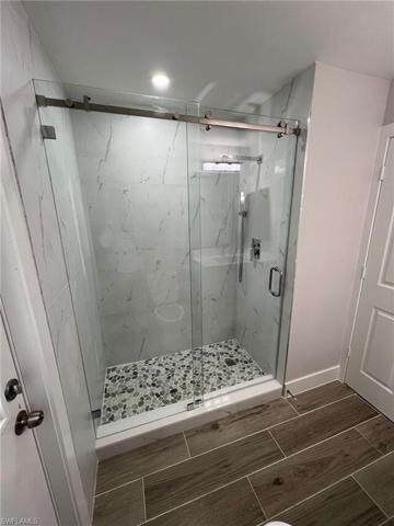 Glass door and mirrors installed
