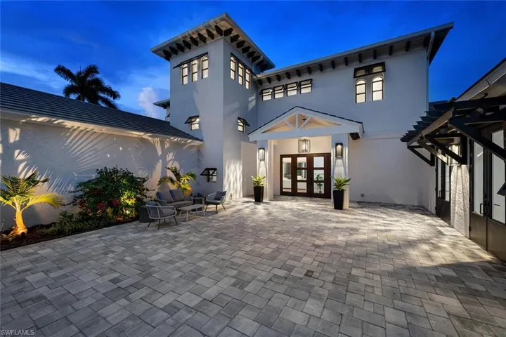 Rear view of house with french doors and a patio area