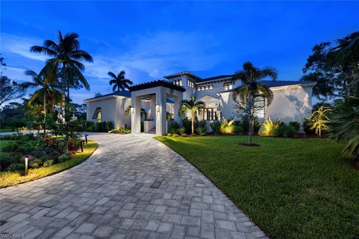 Mediterranean / spanish-style home with a front yard