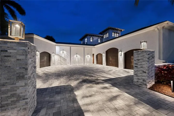 Property exterior at night featuring a garage