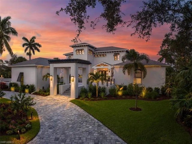 Mediterranean / spanish-style home with a yard and a porch