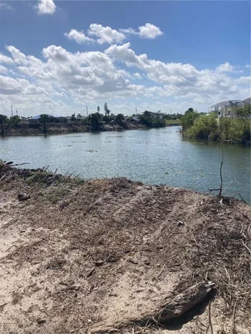 Looking southeast at the intersecting canals. The vegetation has been removed along canal.