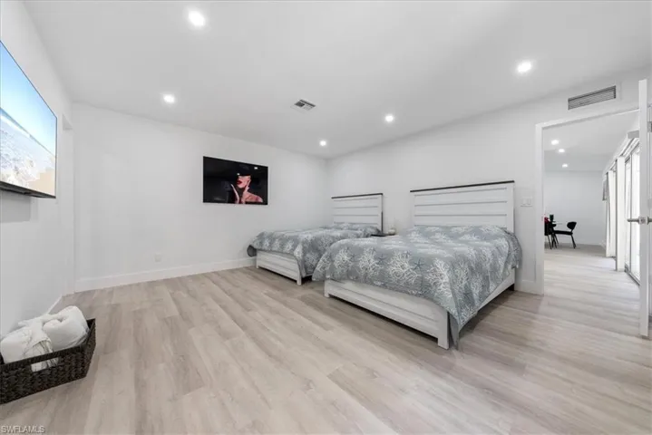 Bedroom featuring light wood-type flooring and recessed lighting