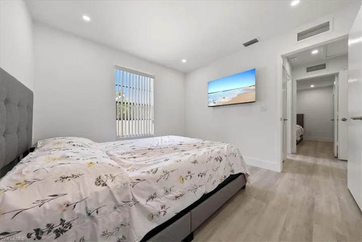 Bedroom featuring recessed lighting and light wood-type flooring