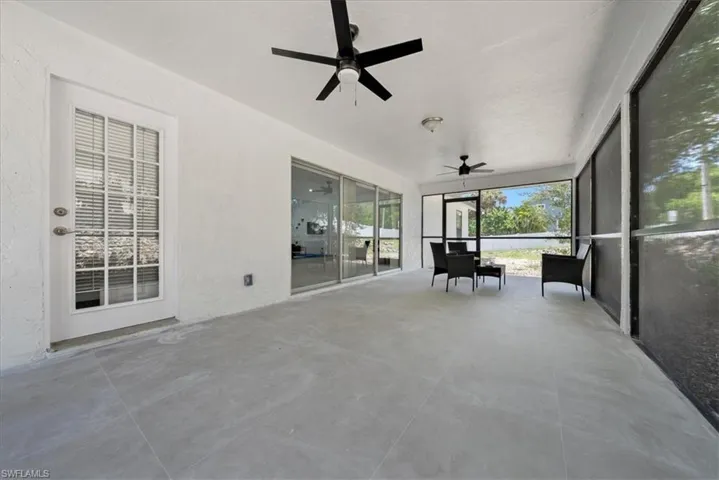 Sunroom with a ceiling fan