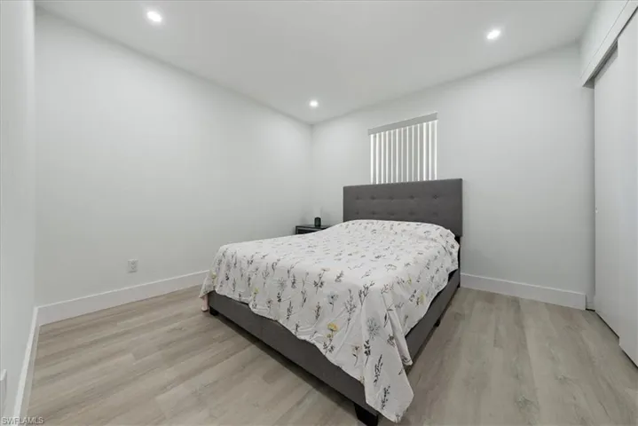 Bedroom with recessed lighting and light wood-style floors
