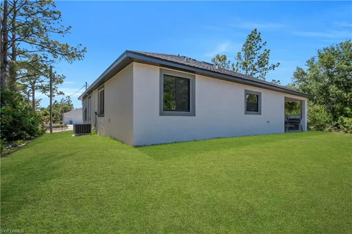 Expansive grass lawn surrounding the property