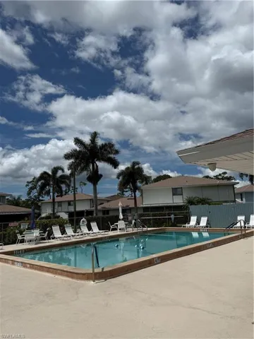 Outdoor swimming pool with integrated steps and a surrounding concrete deck