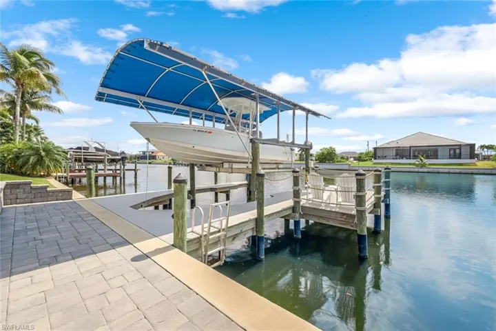 Dock area featuring a water view