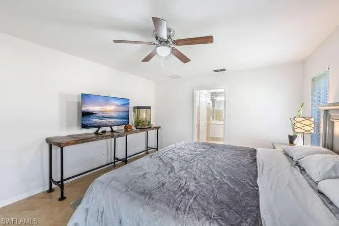Bedroom featuring ceiling fan and light tile patterned flooring