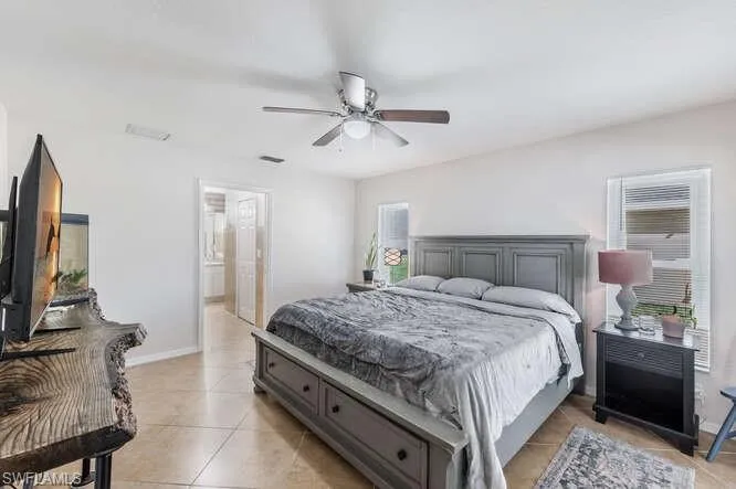 Tiled bedroom with ceiling fan