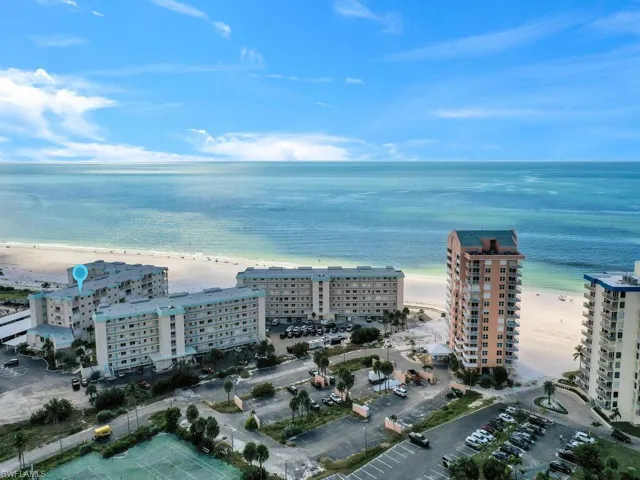 Aerial overview of property's location featuring extended coastline