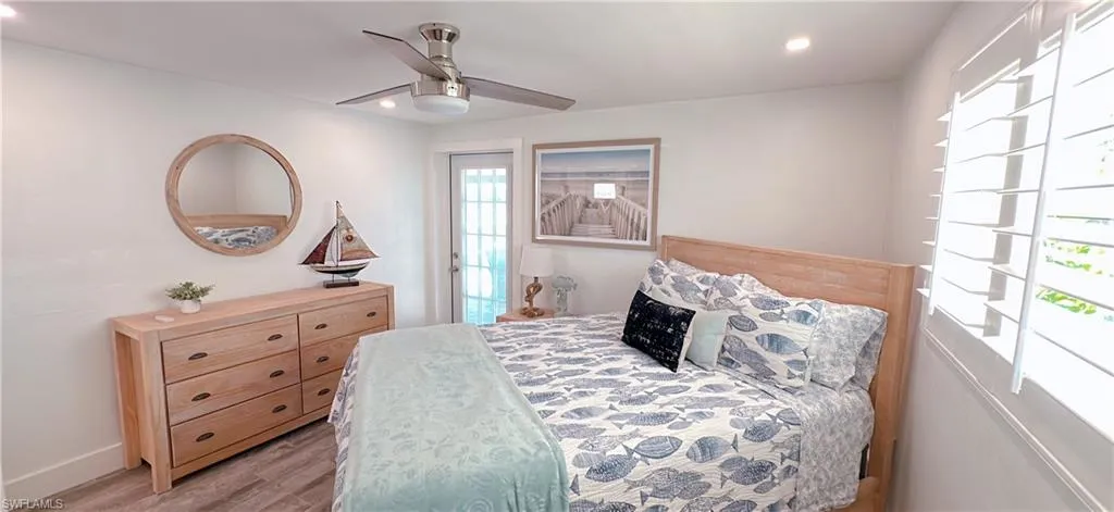 White walls with recessed lighting and a ceiling fan
